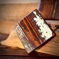 Single handmade heart pine coaster showing preserved old paint and reclaimed wood grain