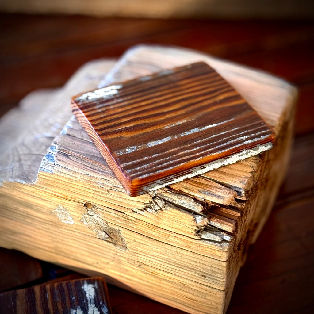 Handmade heart pine coaster resting on reclaimed old Georgia wood